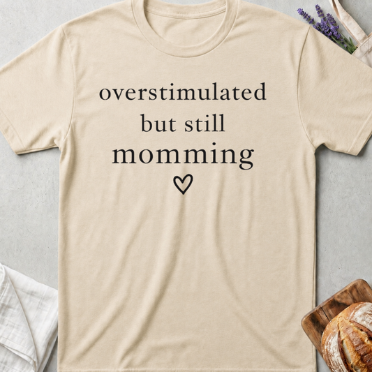 Overstimulated But Still Momming Tee – Relatable Mom Life T-Shirt