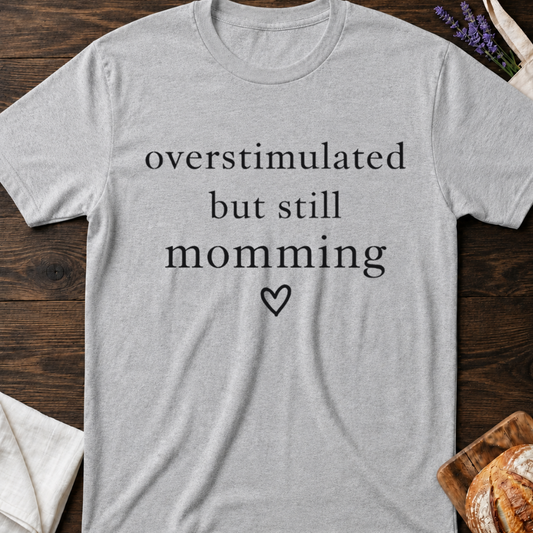 Overstimulated But Still Momming Tee – Relatable Mom Life T-Shirt